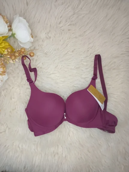 Flat lay of the Xelxia Deep Wine smooth cup push up bra.