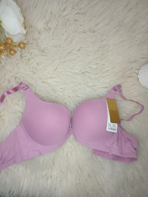 Flat lay of the Xelxia Dusty Rose smooth cup push up bra.