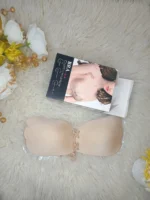 Flat lay of the Xelxia fabric outer invisible sticky bra with its packaging.
