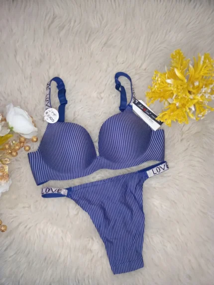 Flat lay of the Xelxia French Blue bra and panty set showing ribbed fabric texture and crystal details.