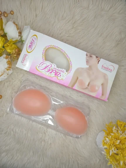 Flat lay of the Xelxia reusable invisible silicone bra in its protective packaging.