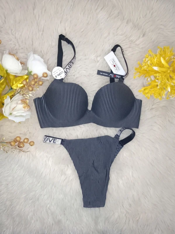 Flat lay of the Xelxia Midnight Charcoal bra and panty set showing ribbed fabric texture and crystal details.