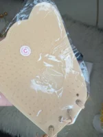 Inside view of the Xelxia sticky bra showing the breathable adhesive and protective adhesive-free center zone.
